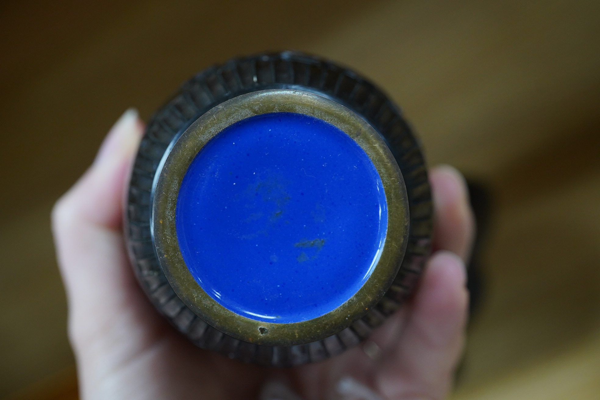 A Chinese bronze bowl, 17cm diameter, a lacquer vase, 15cm high, and a Chinese hand mirror with ivory inlay (3). CITES Submission reference 1UK5HNLM. Condition - fair to good